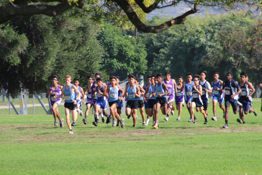 MVL Champ Noah Hibbard (second from left) leads the Varsity Boys off the line.